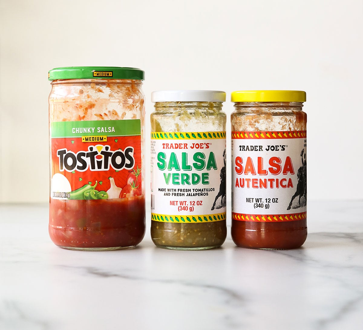 three jars of salsa that were used to test bean dip.