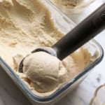 coconut ice cream scooped out of a glass container.