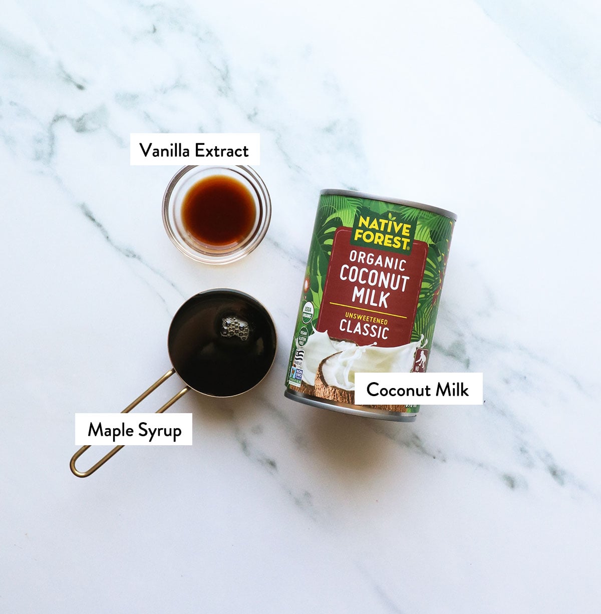 coconut, maple syrup, and vanilla labeled on a surface.
