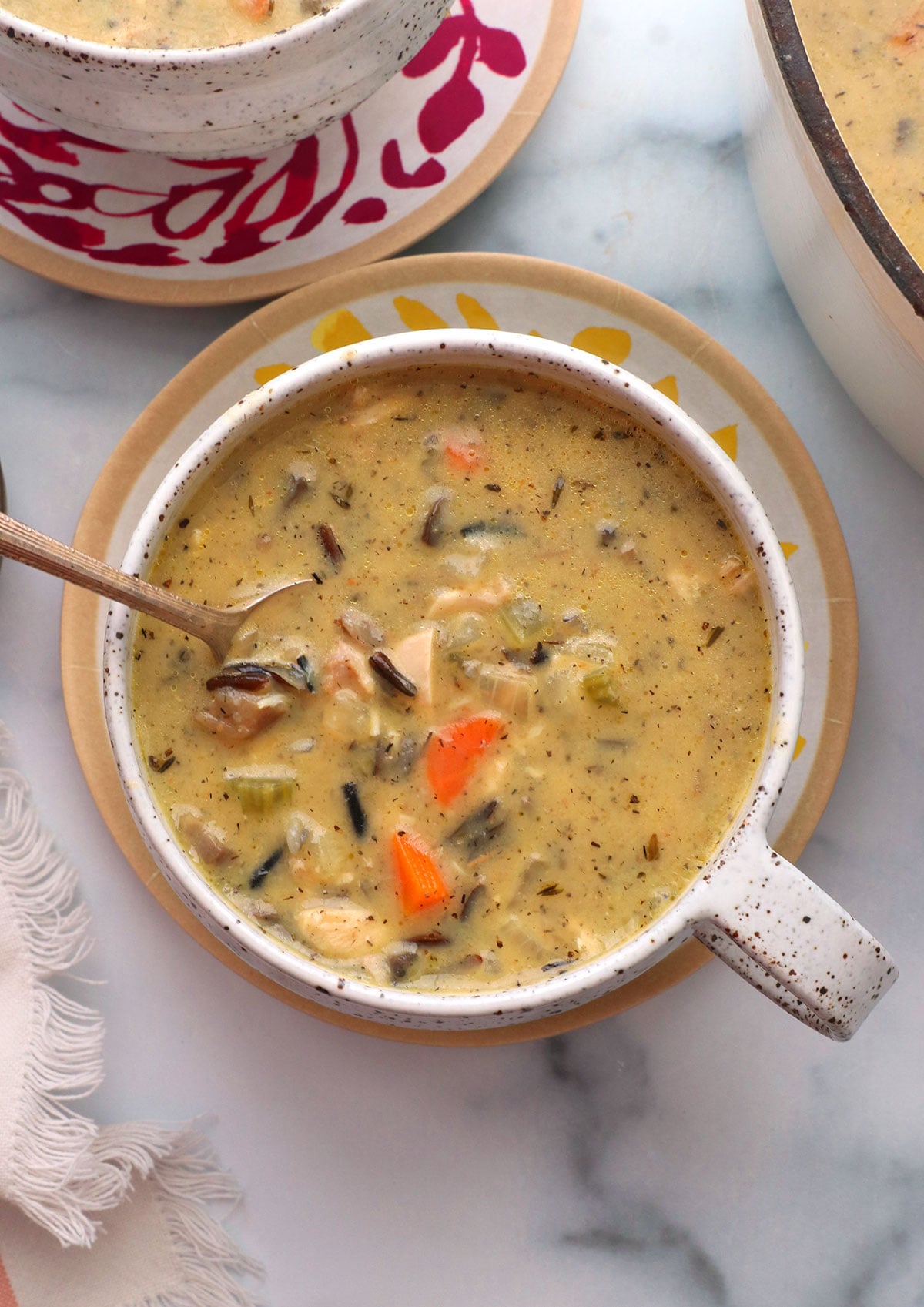 creamy chicken and wild rice soup in a mug.