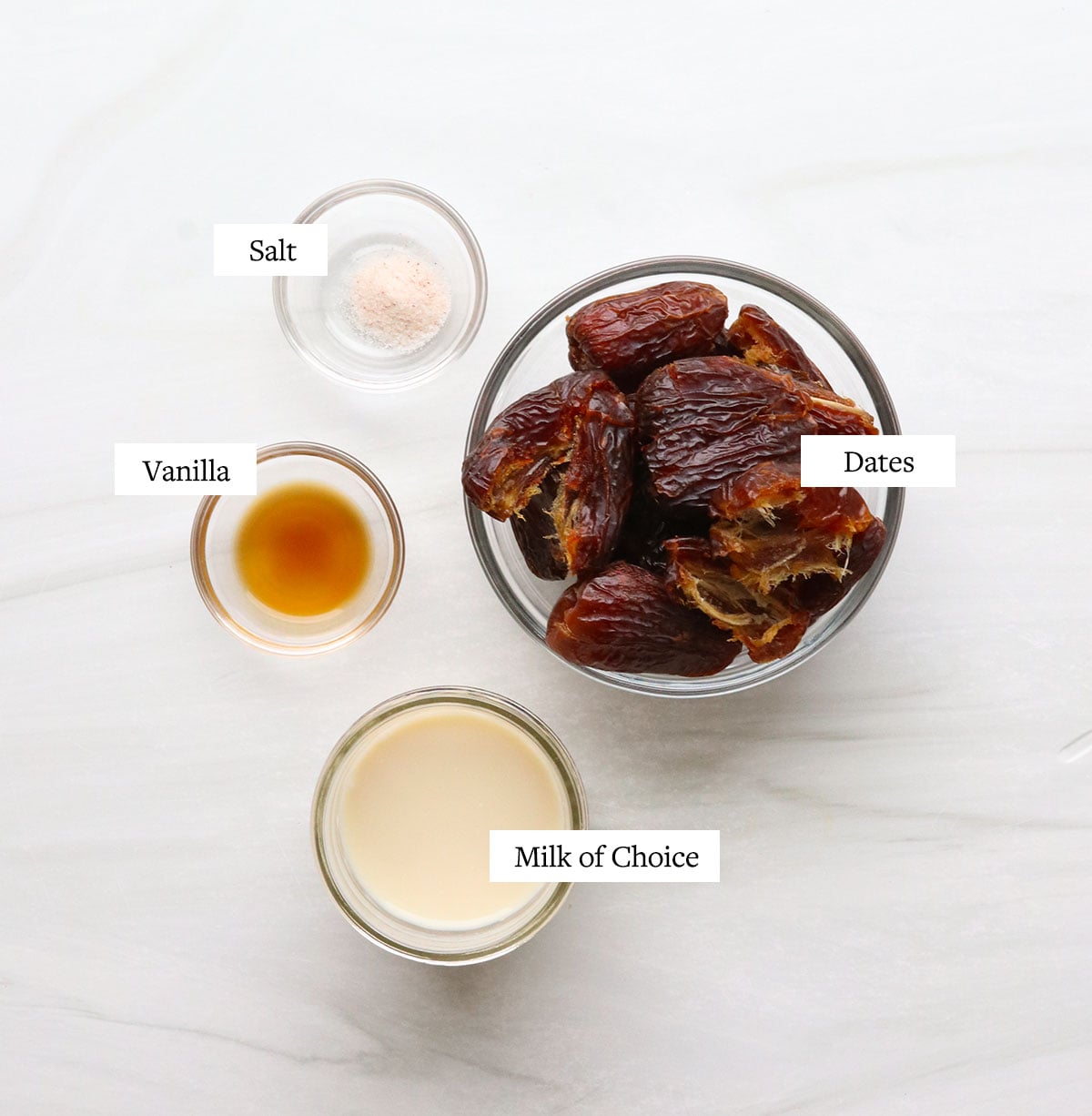 date caramel ingredients labeled in glass bowls.