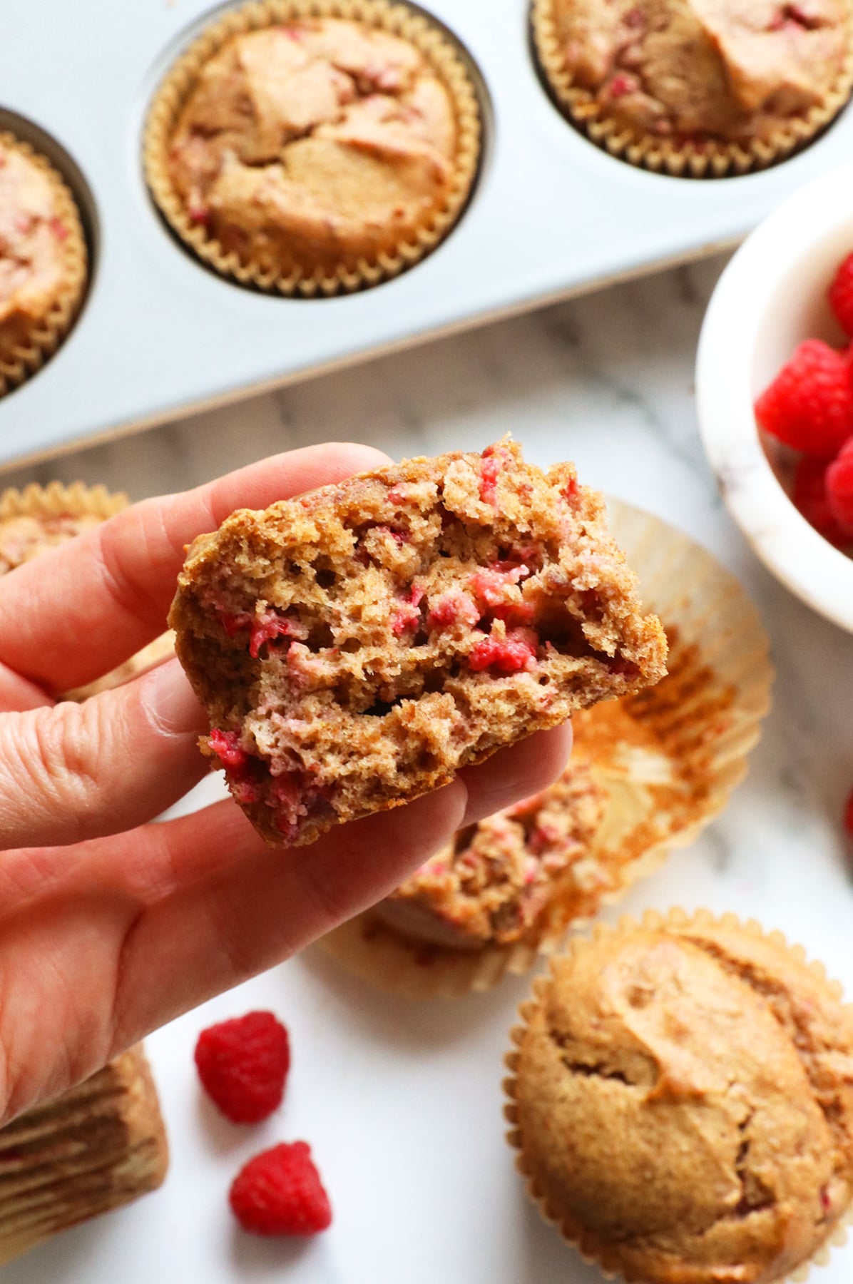 fluffy date sweetned muffin split in half to show the texture.