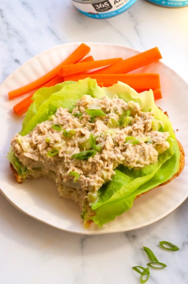 tuna salad without mayo served on butter lettuce with carrots on the side.