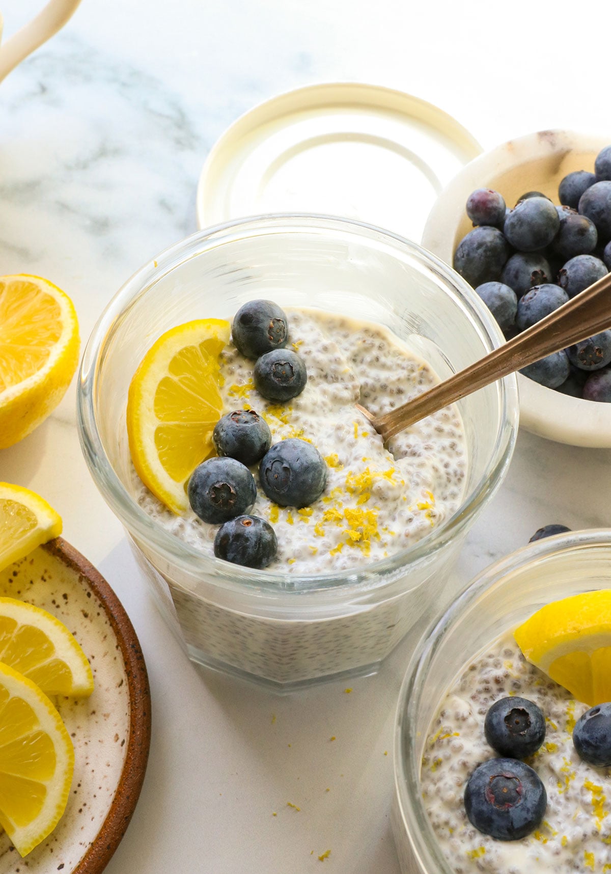 lemon chia seed pudding topped with blueberries