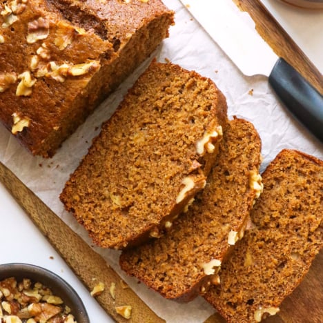 oat flour banana bread sliced on parchment paper.