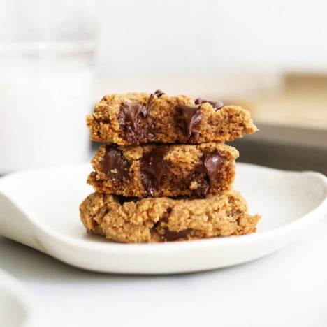 protein cookies split in half and stacked on plate.