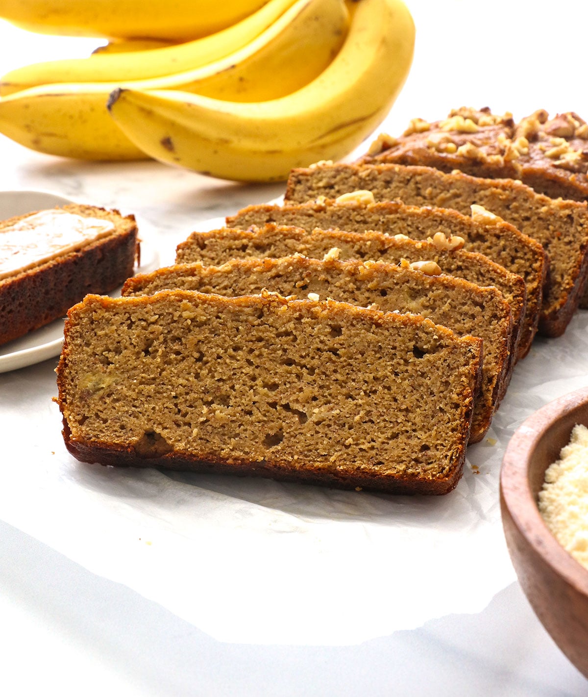 coconut flour banana bread slices at an angle to show their size.