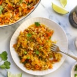 spaghetti squash chicken stir fry served on a plate with cilantro on top.