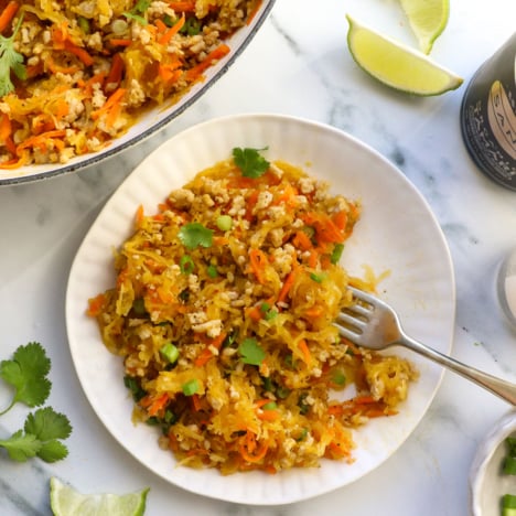 spaghetti squash chicken stir fry served on a plate with cilantro on top.