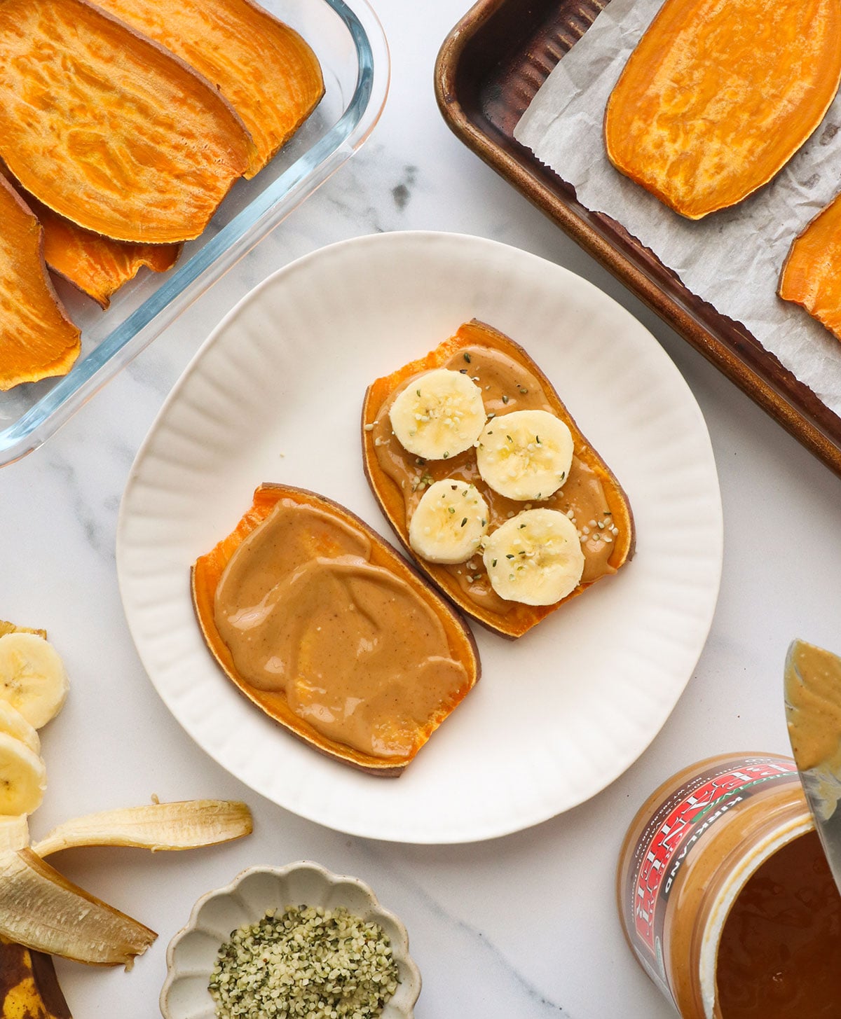 sweet potato toast on a white plate with banana slices on top.
