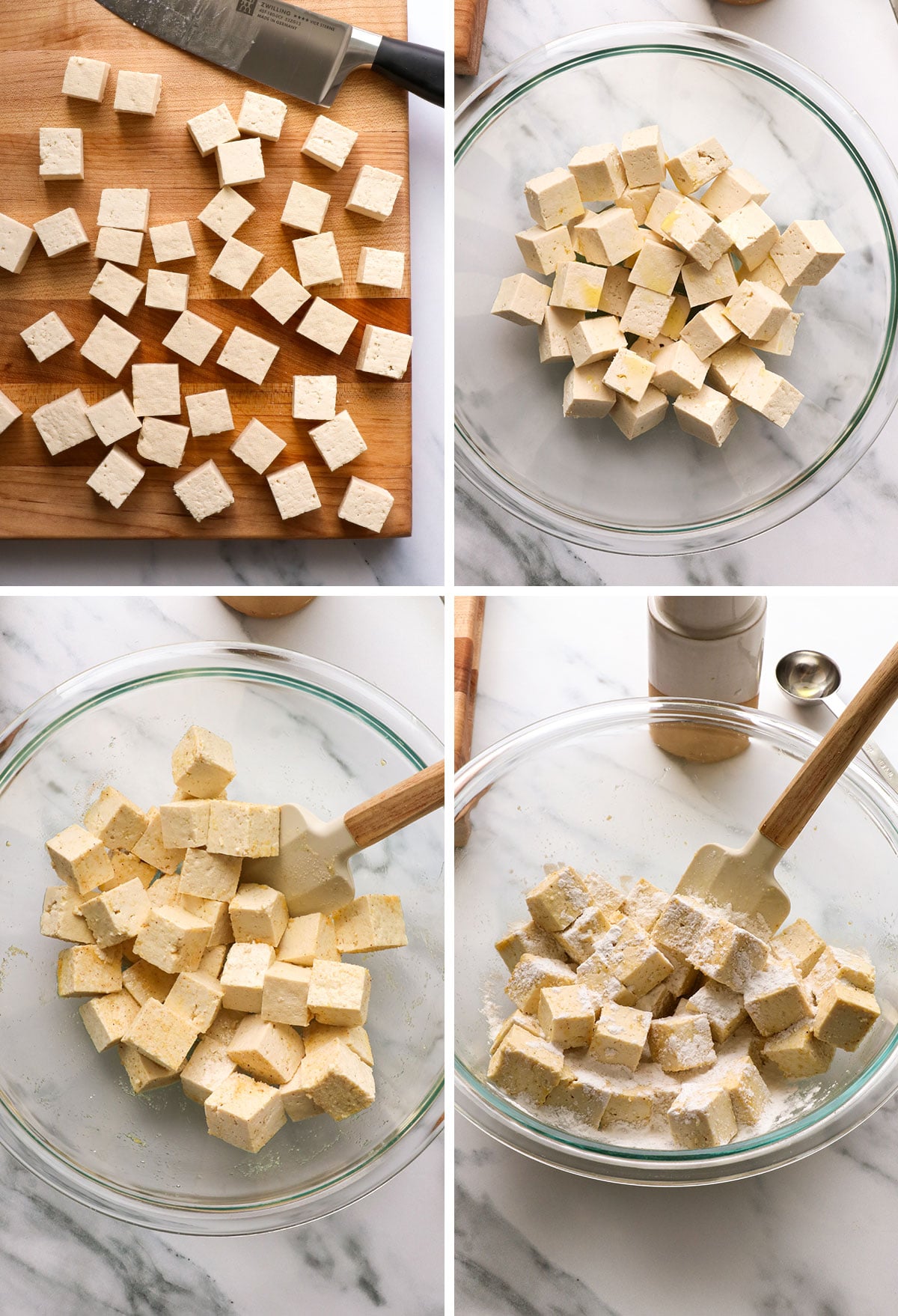 tofu cubed and tossed with spices in a bowl.