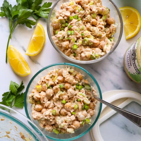 two jars of tuna and chickpea salad with lids.