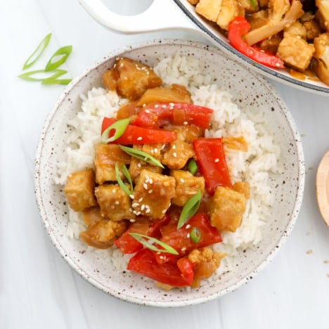 vegan orange chicken served over cooked rice.