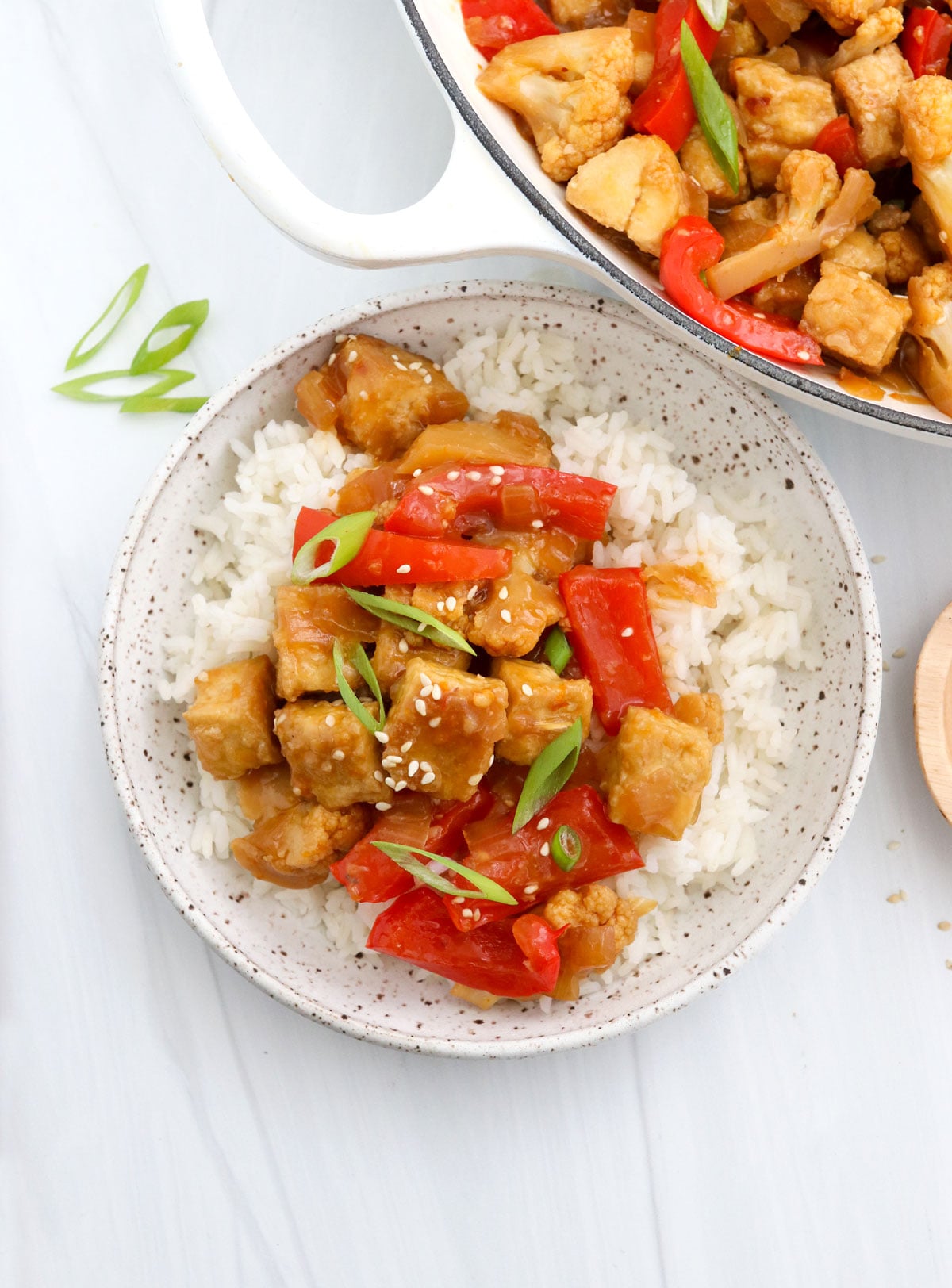 vegan orange chicken served over cooked rice.